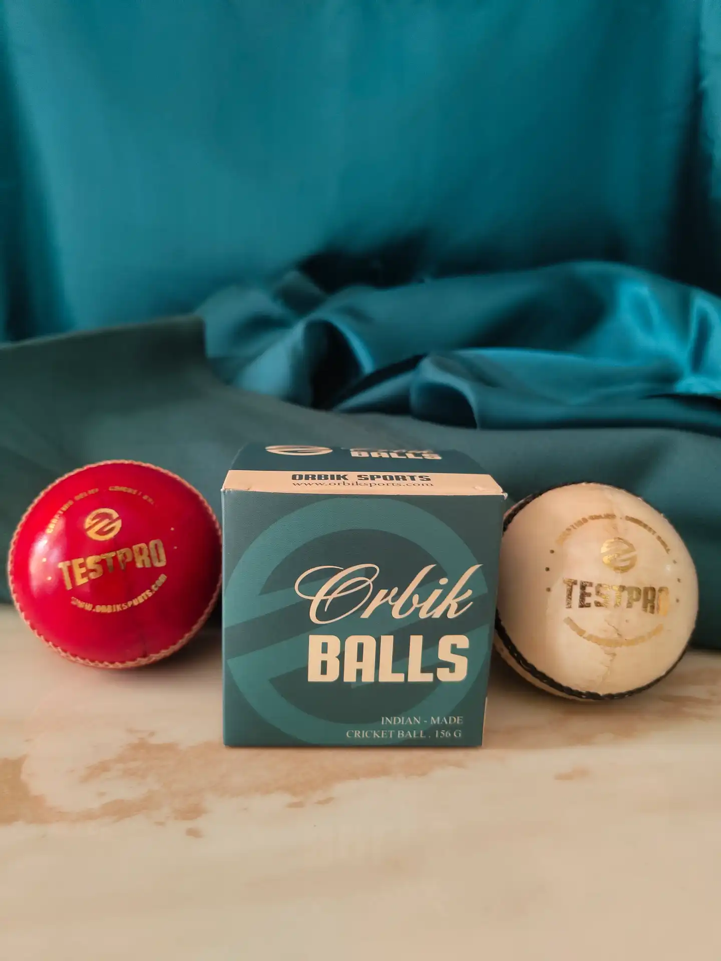 TestPro cricket ball with Orbik Balls box and red and white cricket balls